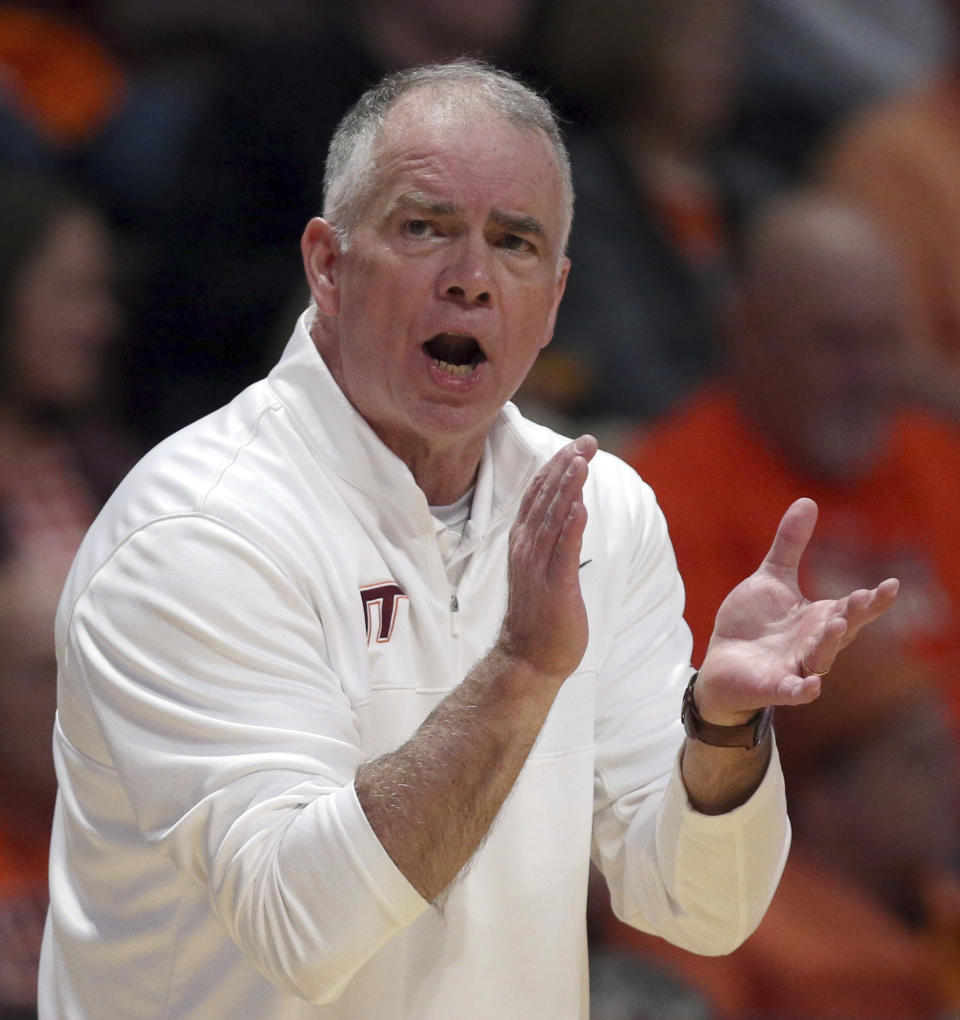 Virginia Tech head coach Mike Young reacts in the first half of an NCAA college basketball game against Louisville in Blacksburg, Va., Sunday, Dec. 3, 2023. (Matt Gentry/The Roanoke Times via AP)