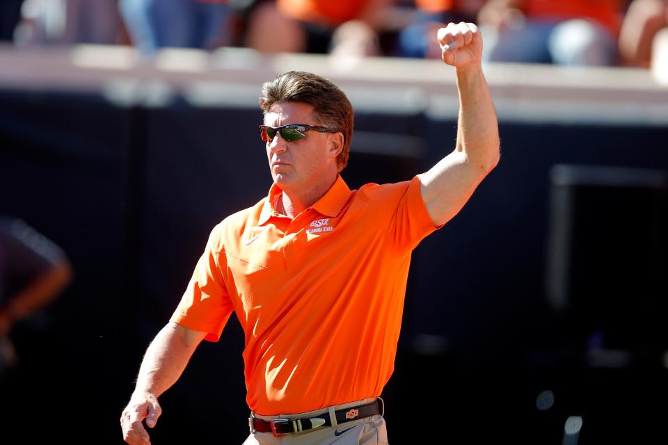 Oklahoma State coach Mike Gundy gestures to the crowd before last year's game against Texas at Boone Pickens Stadium in Stillwater on Oct. 22. Oklahoma State won 41-34.