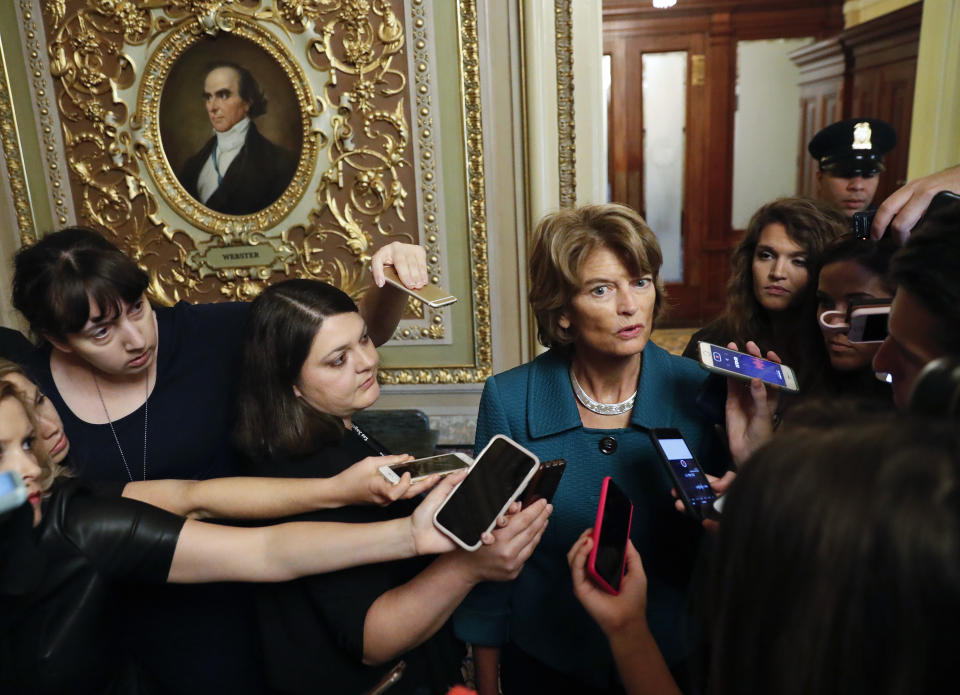 File - In this Oct. 4, 2018 file photo, Sen. Lisa Murkowski, R-Alaska, speaks to members of the media after a vote to advance Brett Kavanaugh's nomination to the Supreme Court, on Capitol Hill. Alaska Republican party leaders plan to consider whether to reprimand Murkowski for opposing Kavanaugh's confirmation. The party has asked Murkowski to provide any information she might want its state central committee to consider. Murkowski told reporters that if she worried about political repercussions she wouldn't be able to do the job Alaskans expect her to do. (AP Photo/Pablo Martinez Monsivais, File)