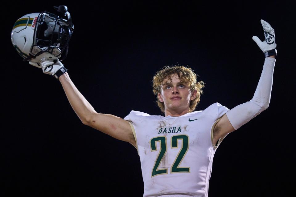 Basha Bears defensive back Tommy Prassas (22) celebrates while standing on the bench as his team takes the lead over the Chandler Wolves at Austin Field in Chandler on Oct. 28, 2022.