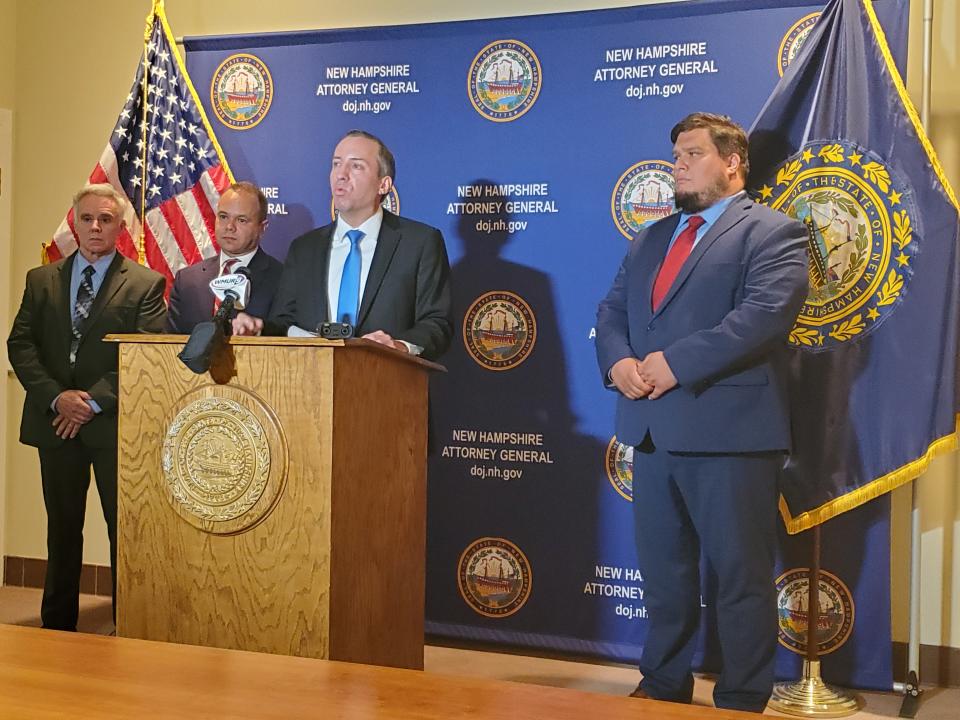 New Hampshire Attorney General John Formella, at podium, announces charges against Strafford County Sheriff Mark Brave at the state Department of Justice Thursday, Aug. 17, 2023. From left are Deputy Chief of Investigations Todd Flanagan Senior Assistant Attorney General Dan Jimenez, Formella, and Joe Fincham II, assistant attorney general and member of the Public Integrity Unit.