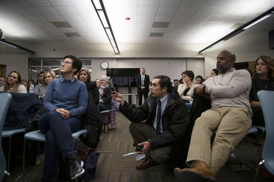 Parents discuss their experiences and opinions on racism in the Saline community and schools during a school diversity and inclusion meeting community meeting at Liberty School in Saline, Mich., Monday, Feb. 3, 2020. The meeting was hosted by Saline Area Schools in response to the racist Snapchat incident that occurred this past week. (Nicole Hester/Ann Arbor News via AP)