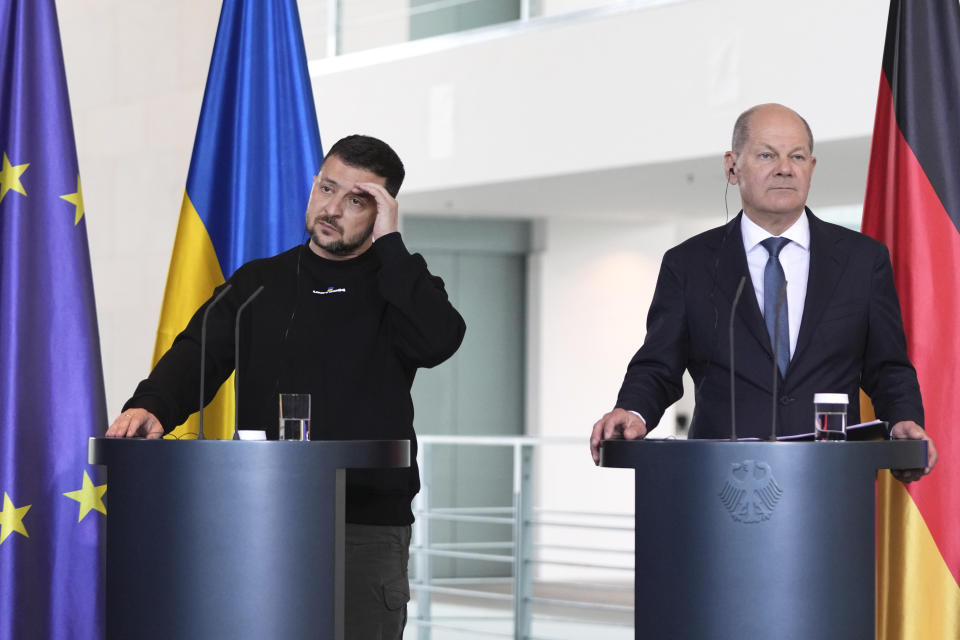 Germany's Chancellor Olaf Scholz, right, and Ukraine's President Volodymyr Zelenskyy address a media conference at the chancellery in Berlin, Germany, Sunday, May 14, 2023. Ukrainian President Volodymyr Zelenskyy arrived in Berlin early Sunday for talks with German leaders about further arms deliveries to help his country fend off the Russian invasion and rebuild what's been destroyed by more than a year of devastating conflict. (AP Photo/Matthias Schrader)