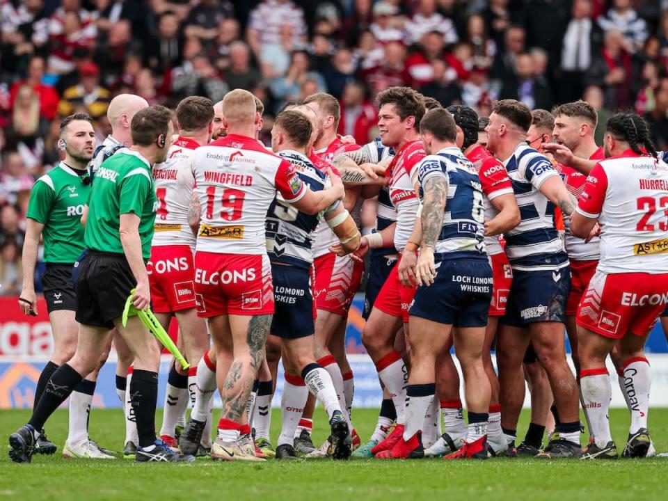 Sam Powell Wigan and St Helens players come together SWpix Credit: PA Images