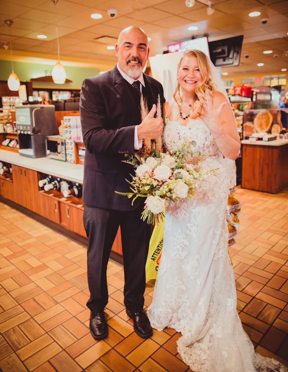 A bride and groom in a convenience store.