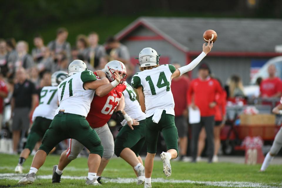 Madison's Cameron Kuhn (14) set a new program record for pass attempts in a game in the Rams' loss to River Valley.