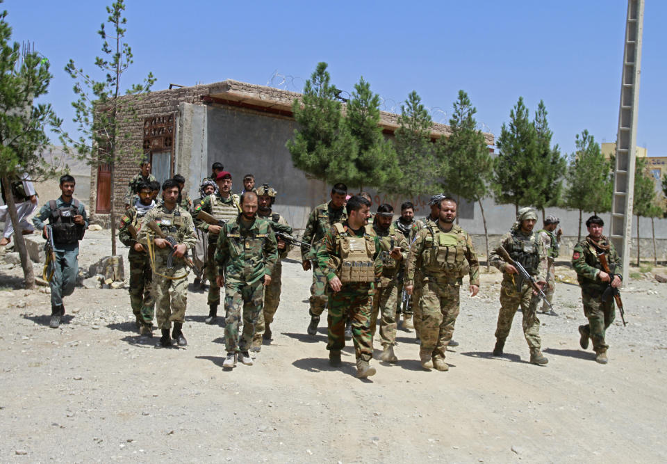 Afghan security personnel patrol after they took back control of parts of the city of Herat following fighting between Taliban and Afghan security forces, on the outskirts of Herat, 640 kilometers (397 miles) west of Kabul, Afghanistan, Sunday, Aug. 8, 2021. (AP Photo/Hamed Sarfarazi)