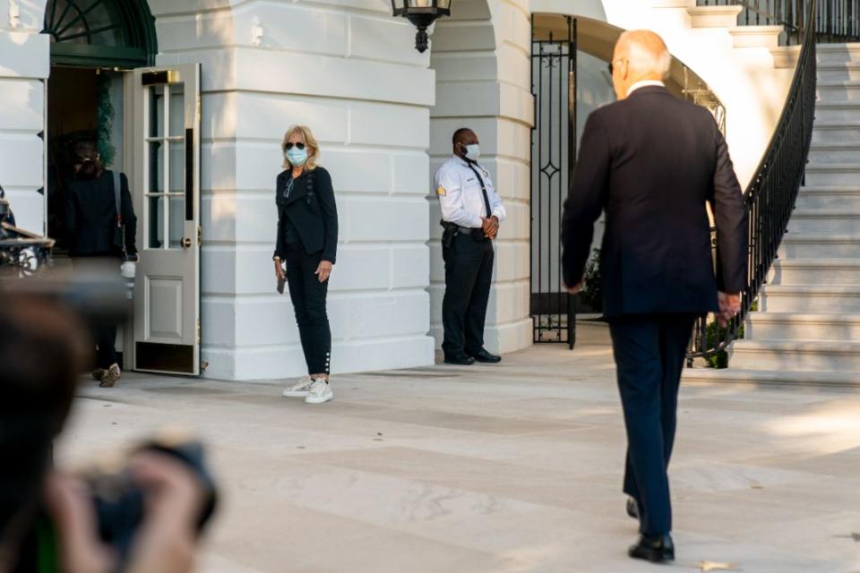 Jill Biden and President Joe Biden arrive at the White House in Washington, Sunday, Sept. 26, 2021, after returning from a weekend at Camp David. - Credit: AP