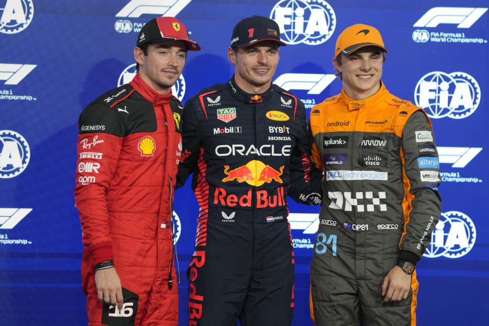 From left: Ferrari driver Charles Leclerc of Monaco, Red Bull driver Max Verstappen of the Netherlands, and McLaren driver Oscar Piastri of Australia pose after qualifying session ahead of the Abu Dhabi Formula One Grand Prix at the Yas Marina Circuit, Abu Dhabi, UAE, Saturday, Nov. 25, 2023. (AP Photo/Kamran Jebreili)