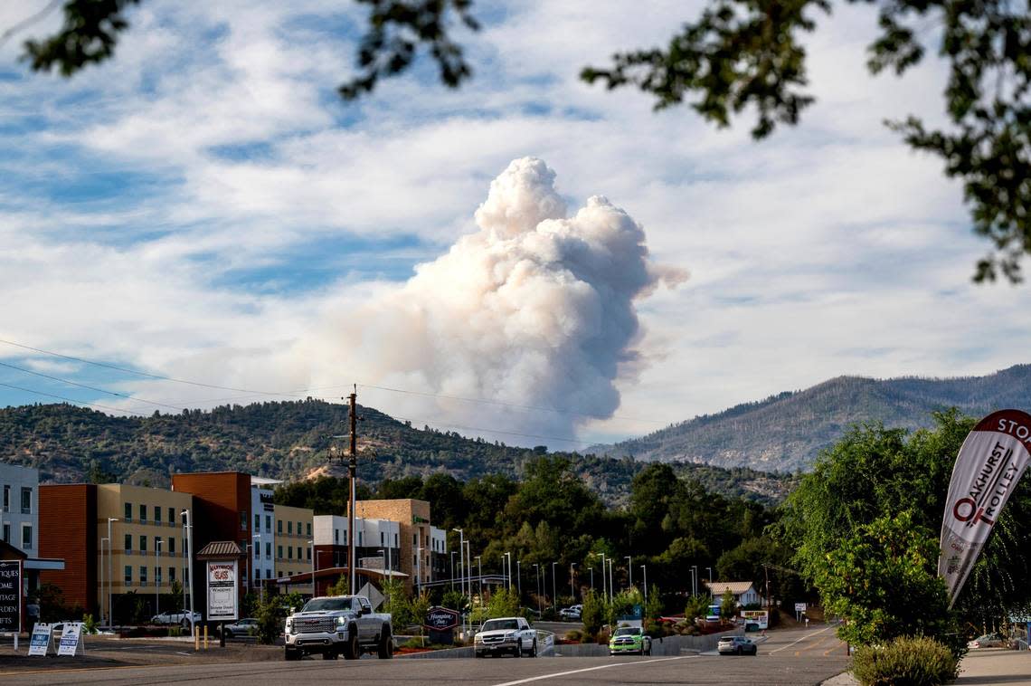 Viewed from Oakhurst in Madera County, Calif., a plume rises from the Washburn Fire burning in Yosemite National Park on Friday, July 8, 2022.