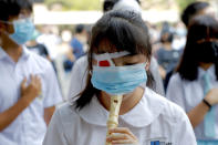 Students gather during a school children's strike event in support of protest movement in Hong Kong Monday, Sept. 30, 2019. Hong Kong authorities Monday rejected an appeal for a major pro-democracy march on National Day’s holiday after two straight days of violent clashes between protesters and police in the semi-autonomous Chinese territory roused fears of more showdowns that would embarrass Beijing. Red patch symbols the protester who lost eye sight as a result of a police attack. (AP Photo/Gemunu Amarasinghe)