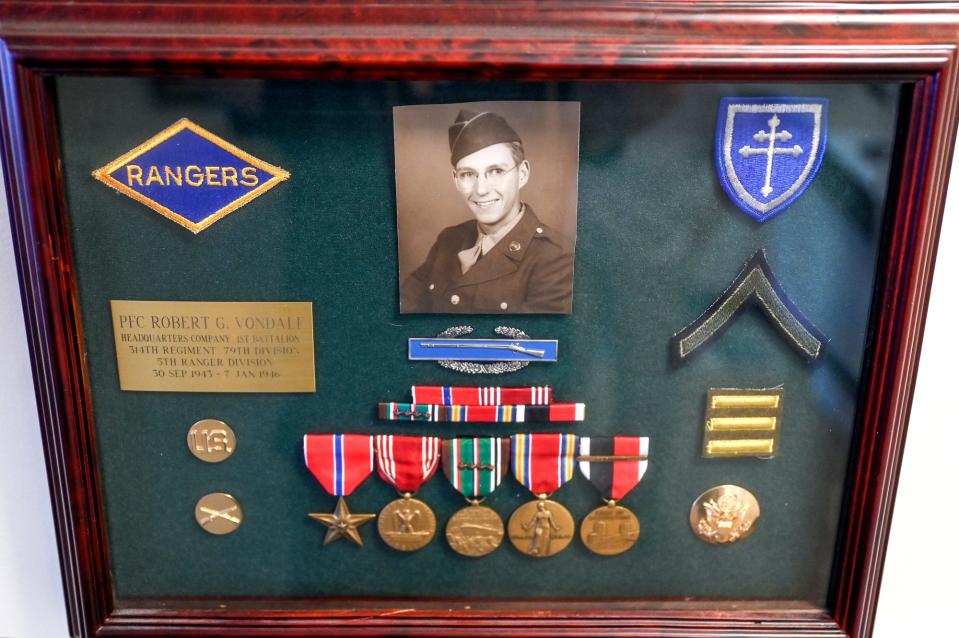 A display of Robert Vondale's military service hangs in his home on Monday, July 18, 2022, at his home in Grand Ledge. Vondale is one of the few surviving members of the World War II U.S. Army Ranger battalions. Last month President Biden signed an order to award rangers the Congressional Gold Medal.