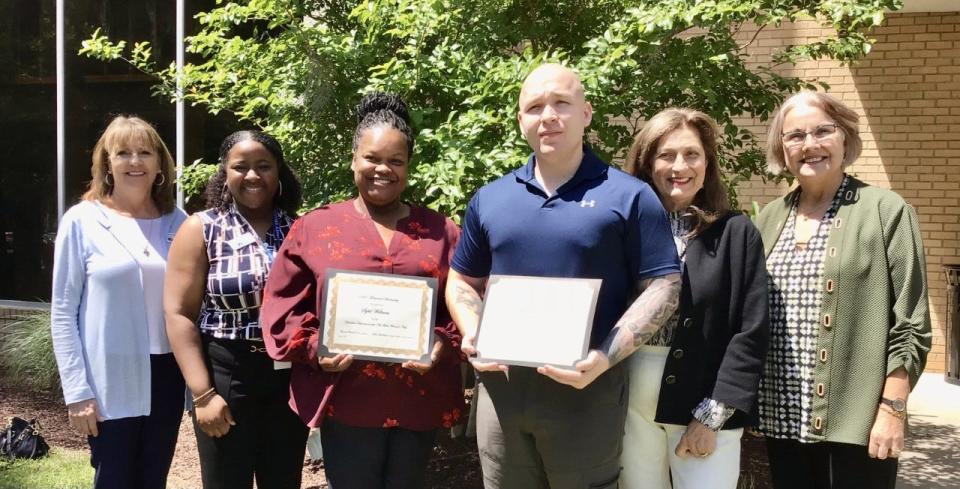 Members of the New Bern Woman's Club are pictured with scholarship recipients. Sybil Williams and Brandon Olson.