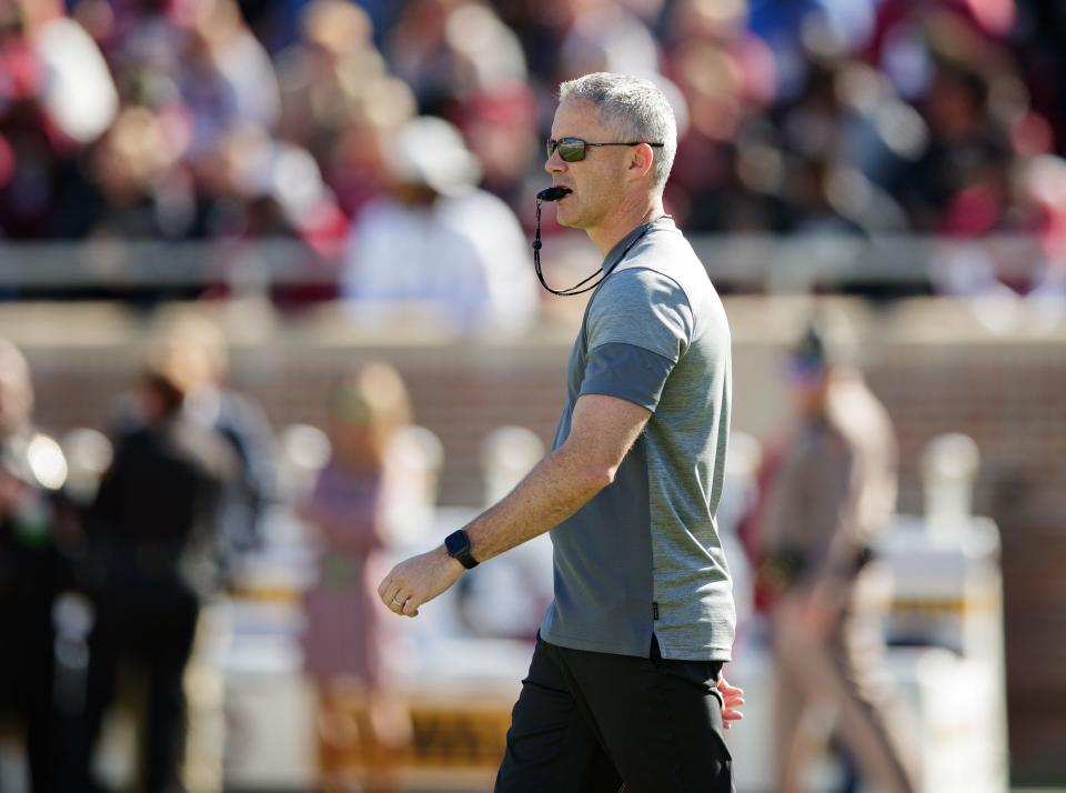 Florida State Seminoles head coach Mike Norvell conducts warm-ups in Doak Campbell Stadium before the Garnet and Gold spring game kickoff Saturday, April 9, 2022.