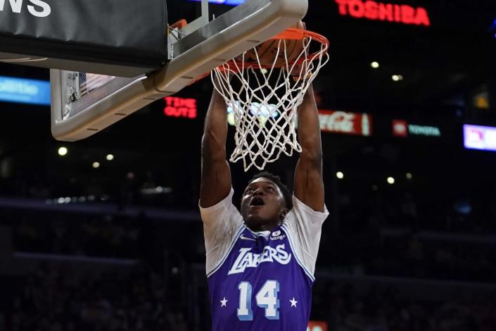 Lakers forward Stanley Johnson dunks during the first half April 8, 2022.