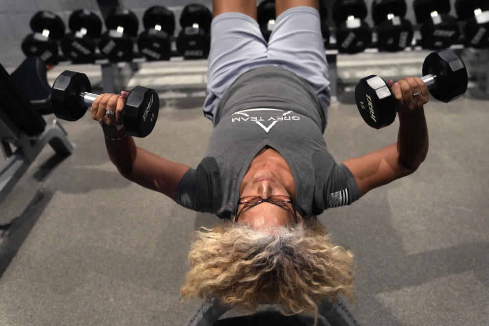 Army Veteran Lisa Browne-Banic works out the at Grey Team veterans center, Thursday, May 11, 2023, in Boca Raton, Fla. The center is helping veterans with post-traumatic stress disorder and other mental and physical ailments get back into the civilian world. (AP Photo/Lynne Sladky)