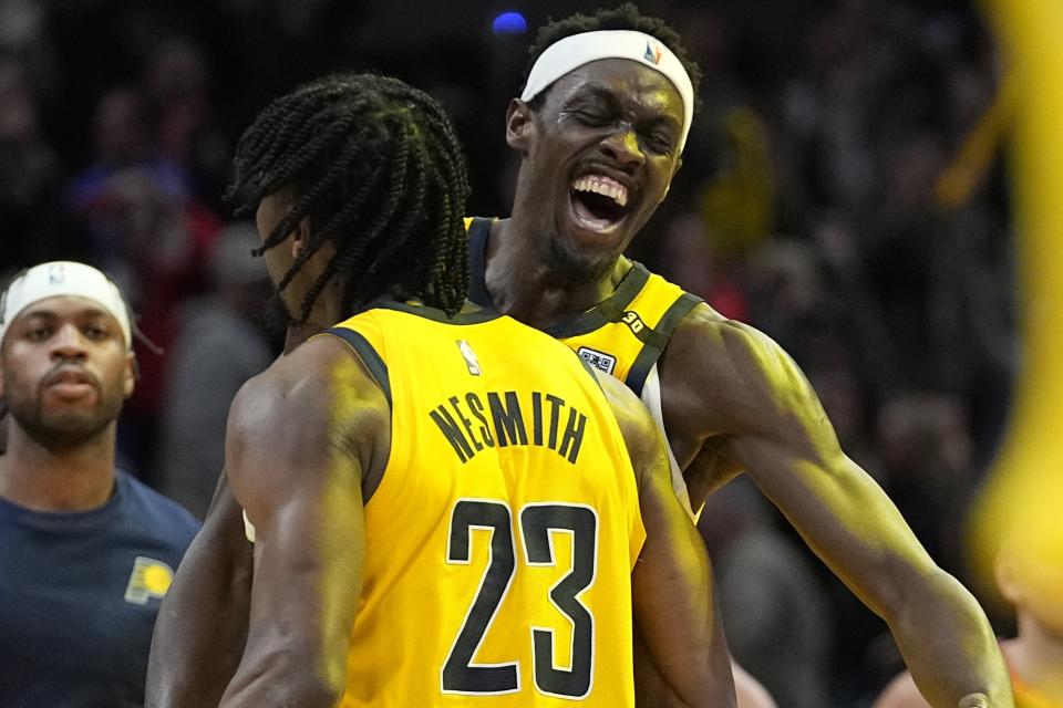 Indiana Pacers' Aaron Nesmith (23) and Pascal Siakam celebrate after Indiana defeated the Phoenix Suns in an NBA basketball game Friday, Jan. 26, 2024, in Indianapolis. (AP Photo/Darron Cummings)