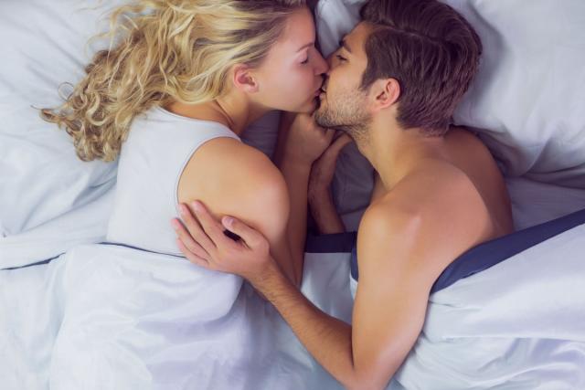 couple having sex in bed woman wearing black bra Stock Photo - Alamy