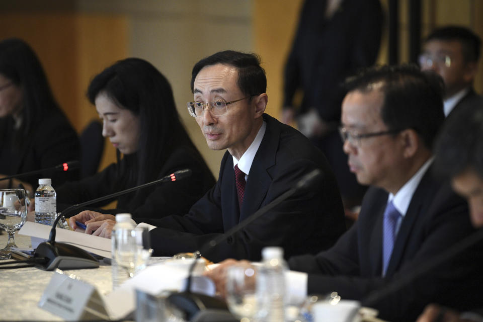 Sun Weidong, center, China's Vice Foreign Minister, delivers his opening statement during the Philippines-China Foreign Ministry consultation meeting at a hotel in Manila on Thursday March 23, 2023. (Ted Aljibe/Pool via AP)