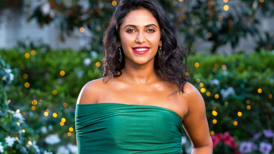 The Bachelor Australia contestant Sogand Mohtat wearing a green off-the-shoulder gown on the show in 2019