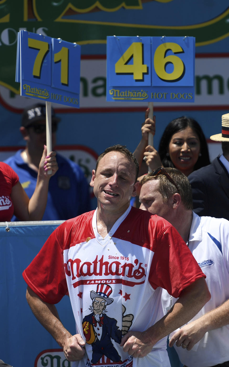 Joey Chestnut reacts after eating 71 hot dogs to win the men's competition of Nathan's Famous July Fourth hot dog eating contest, Thursday, July 4, 2019, in New York's Coney Island. (AP Photo/Sarah Stier)