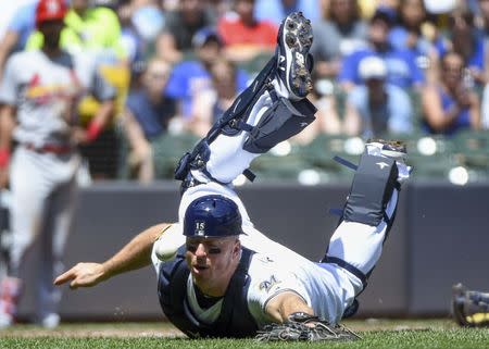 Jun 24, 2018; Milwaukee, WI, USA; Milwaukee Brewers catcher Erik Kratz (15) can't catch foul ball hit by St. Louis Cardinals pitcher Luke Weaver (7) in the second inning at Miller Park. Mandatory Credit: Benny Sieu-USA TODAY Sports