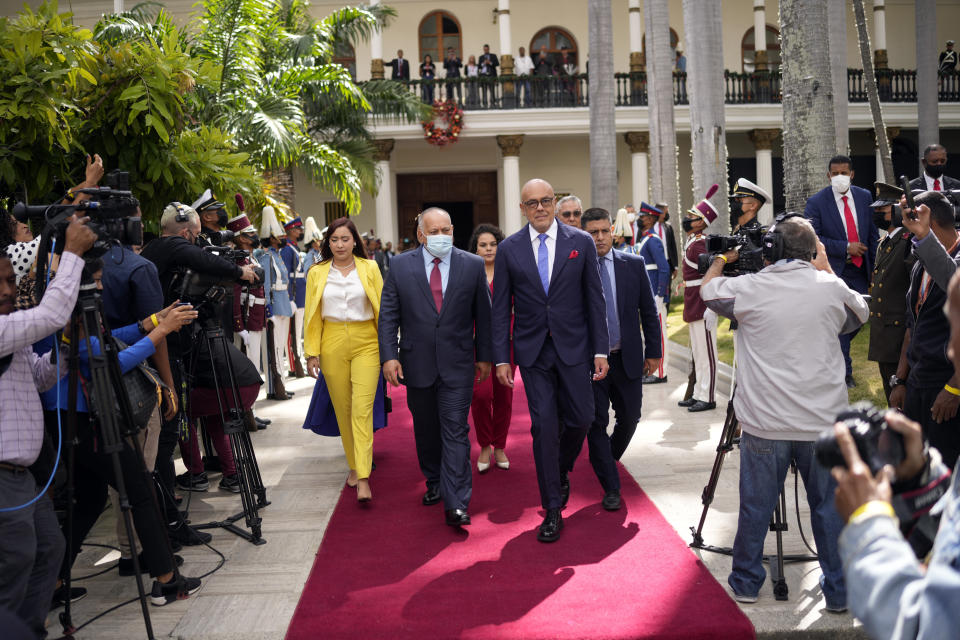 Leaders, from left, America Perez, second vice president of the National Assembly, Diosdado Cabello, lawmaker and first vice president of the ruling United Socialist Party of Venezuela (PSUV), and, National Assembly President Jorge Rodriguez walk on the grounds of the assembly after being sworn-in for the new legislative year in Caracas, Venezuela, Thursday, Jan. 5, 2023. (AP Photo/Matias Delacroix)