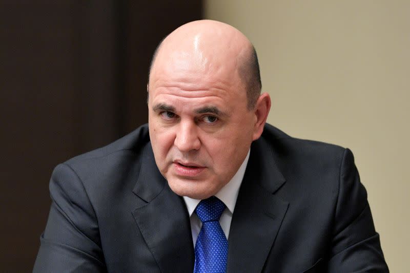 FILE PHOTO: Russian Prime Minister Mikhail Mishustin attends a meeting with members of the Security Council at the Novo-Ogaryovo state residence