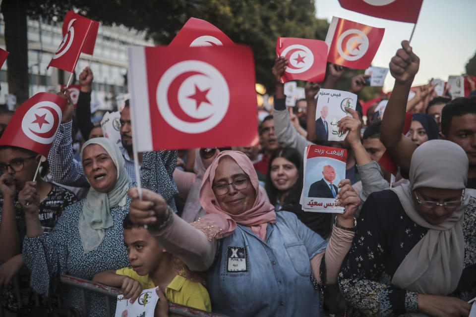 Supporters of independent Tunisian Presidential candidate Kais Saied attend a rally on the last day of campaigning before the second round of the presidential elections, in Tunis, Tunisia, Friday, Oct. 11, 2019. (AP Photo/Mosa'ab Elshamy)