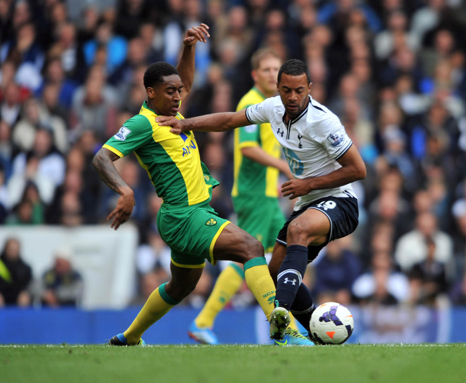 Tottenham's Mousa Dembele and Norwich's Nathan Redmond during the Barclays Premier League match at White Hart Lane, Tottenham.