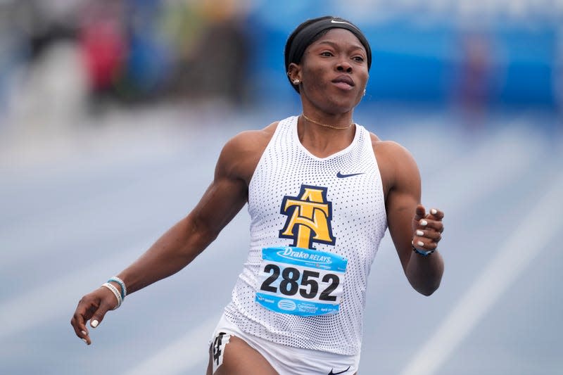 North Carolina A&T’s Grace Nwokocha wins the women’s 100-meter dash at the Drake Relays athletics meet, Saturday, April 30, 2022, in Des Moines, Iowa. The school she competes for stands to los $2 million in funding due to an arcane rule about out-of-state enrollment.