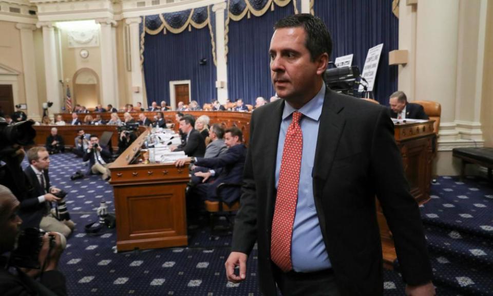 The Republican Devin Nunes walks away from the dais after visiting with Republican committee members.