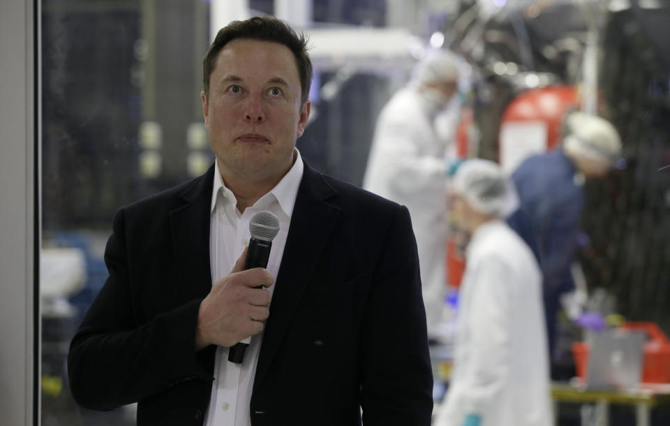 SpaceX chief engineer Elon Musk talks to the media in front of the Crew Dragon spacecraft about the progress to fly astronauts to and from the International Space Station, from American soil, as part of the agency's commercial crew program at SpaceX headquarters, in Hawthorne, Calif., Thursday, Oct. 10, 2019. (AP Photo/Alex Gallardo)