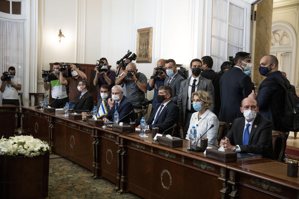 Israeli Foreign Minister Gabi Ashkenazi, third from right, with Egyptian Foreign Minister Sameh Shoukry (not shown), during high-level talks to shore up a fragile truce between Israel and the Hamas militant group at the Tahrir Palace in Cairo, Egypt, Sunday, May 30, 2021. (AP Photo/Nariman El-Mofty)