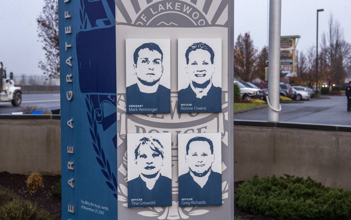 Four slain Lakewood Police officers, Sergeant Mark Renninger, Officer Ronald Owens, Officer Tina Griswold and Officer Greg Richards, are depicted in the memorial to them outside Blue Steele Coffee Company in Parkland, Nov. 29, 2018.