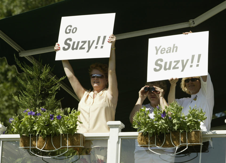 Residents along the course encourage Suzy Whaley as she passes by during the second round of the Greater Hartford Open on July 25, 2003, at TPC at River Highlands in Cromwell, Connecticut. (Photo by Elsa/Getty Images)