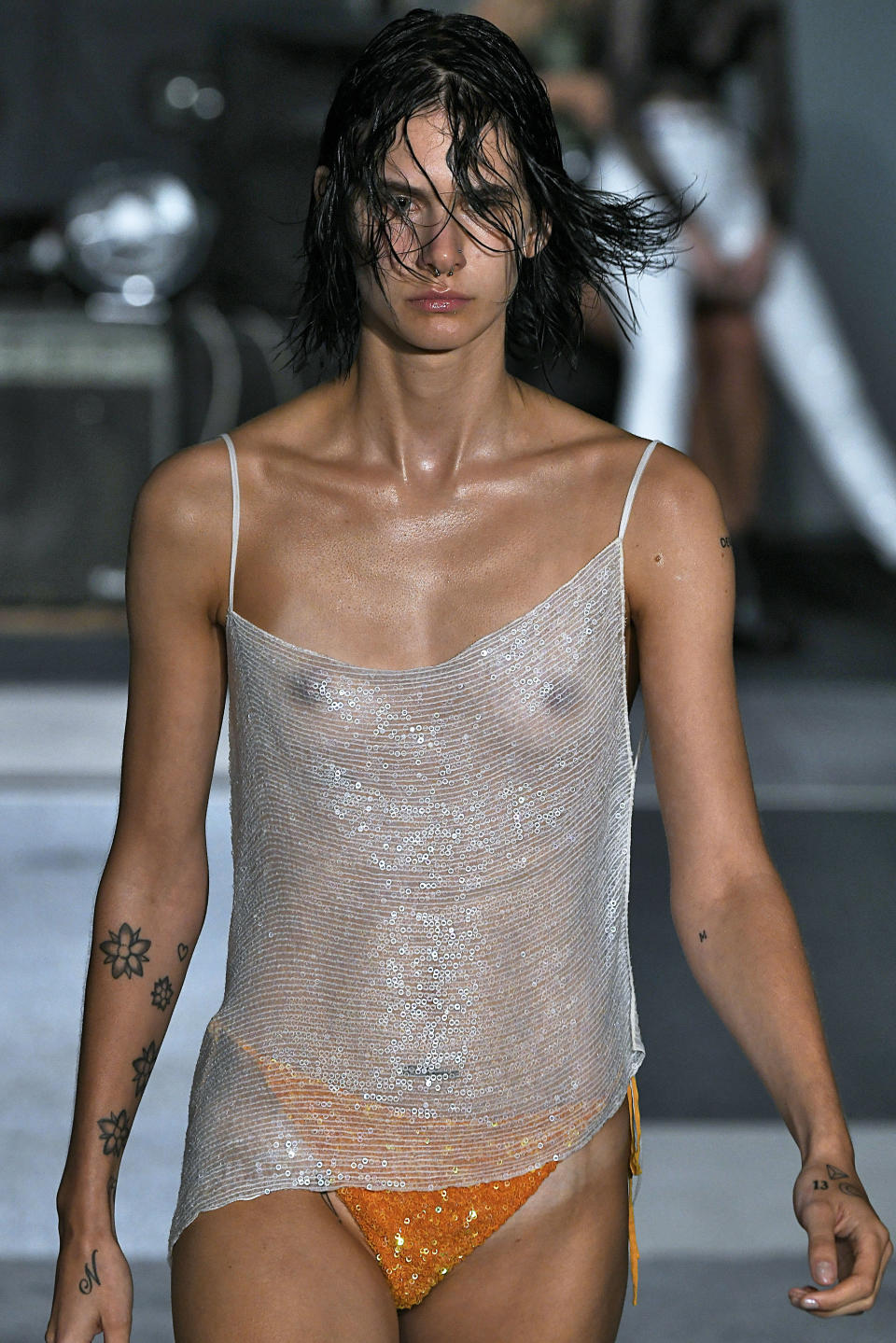 Model wearing sheer top in Ashish show