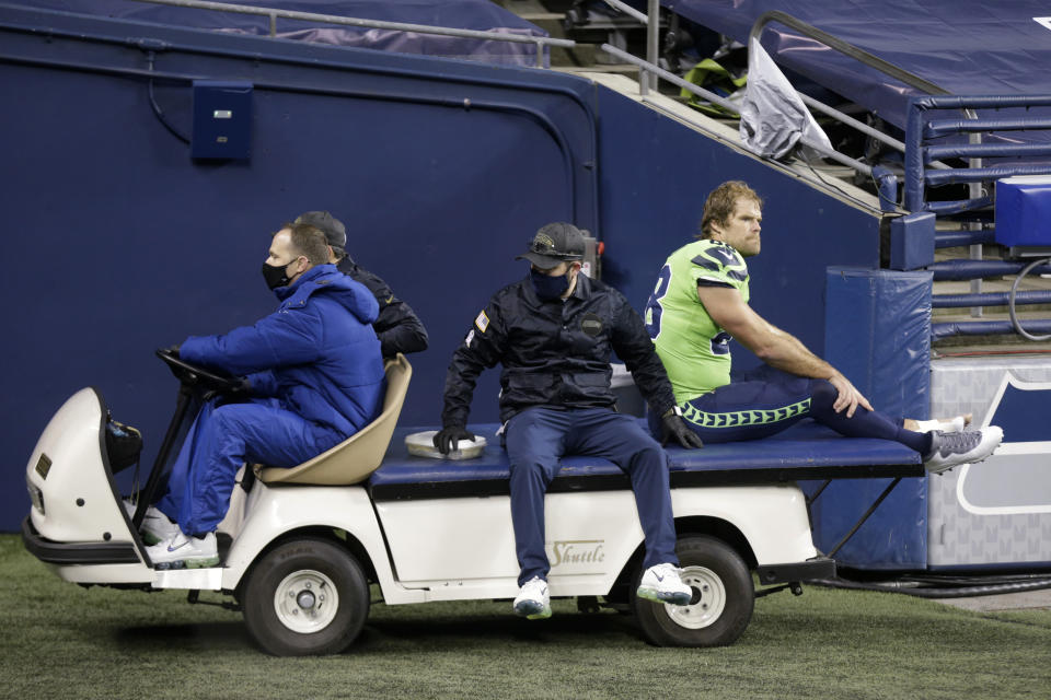 Seattle Seahawks tight end Greg Olsen (88) is taken off the field on a cart after going down with an injury against the Arizona Cardinals during the second half of an NFL football game, Thursday, Nov. 19, 2020, in Seattle. (AP Photo/Lindsey Wasson)