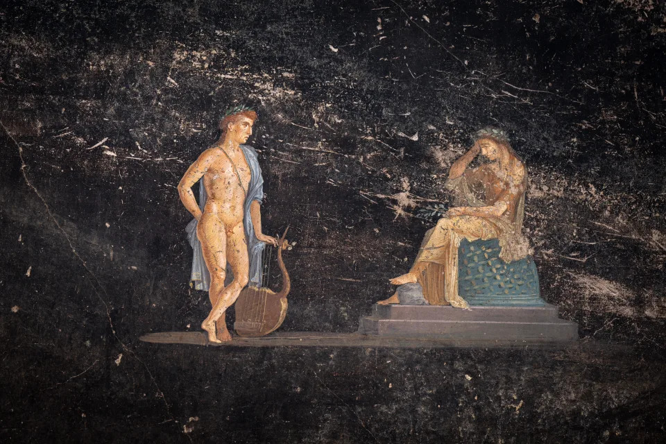 A fresco discovered in a banquet hall in the ancient Italian city of Pompeii depicts the Greek god Apollo attempting to seduce the priestess Cassandra. / Credit: BBC/Tony Jolliffe