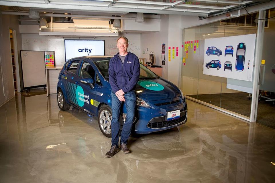 Arity put a Ford Fiesta in its office (pictured, with president Gary Hallgren) as a means to accelerate its work in telematics. That effort is now shaping the business model of its parent company, Allstate.