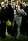 Russian President Vladimir Putin (R) kicks a soccer ball inside Maracana stadium in Rio de Janeiro, November 22, 2004. This is the first state visit of a Russian leader to the major Latin American power. Built in 1950 for the World Cup, Maracana has long been considered the world's largest soccer stadium, where a record of more than 180,000 attended a soccer match, in 1969. Brazil is a five-time winner of the World Cup. REUTERS/Cris Borges