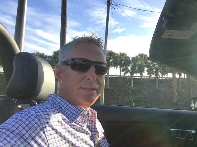 Jeff King, vice president and general manager at Bozard Ford Lincoln in St. Augustine, Florida, said his store has 17 mobile repair vans running. "You blow the customers away," He's seen here parked in his Mustang GT convertible in 2023.