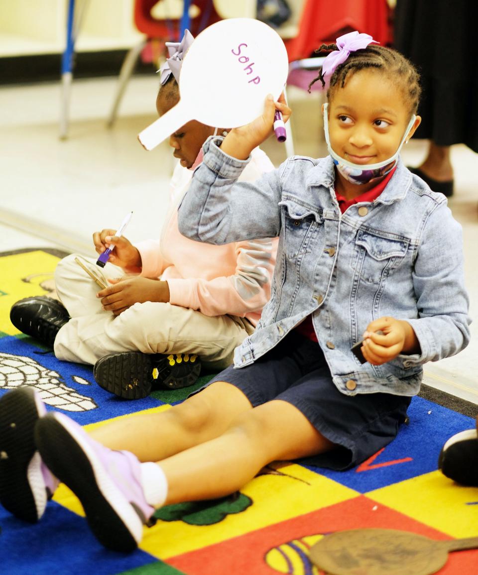 Students from Sophelia Sykes’ class at Spann Elementary School in Jackson, Miss., pronounce and write out words during a session in her kindergarten class.