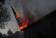 Protestas contra el Gobierno en el primer aniversario de las masivas manifestaciones producidas en el país, en Santiago, Chile