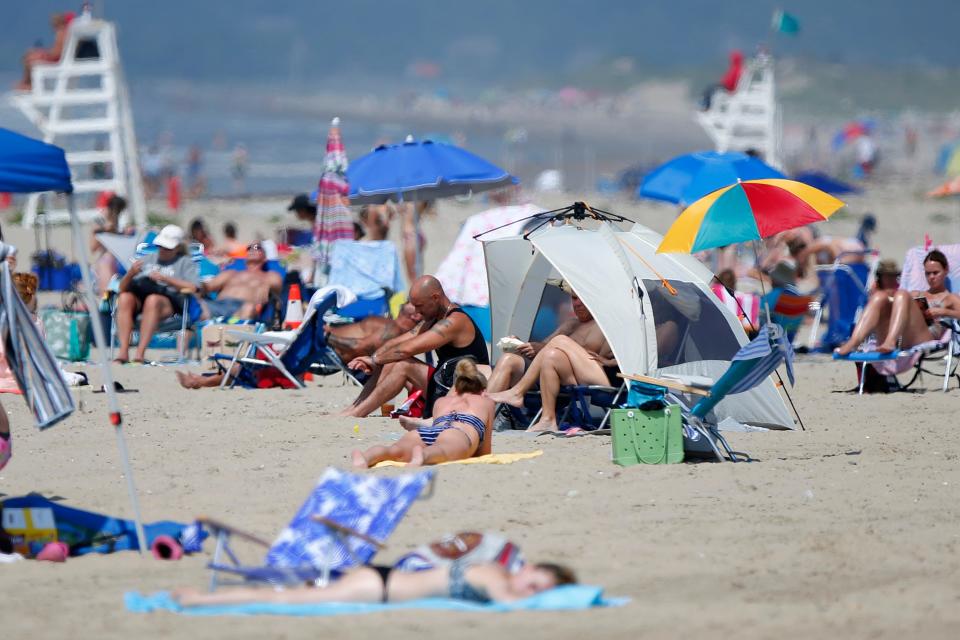 Beachgoers enjoy the first hot day of the season at Horseneck Beach in Westport.