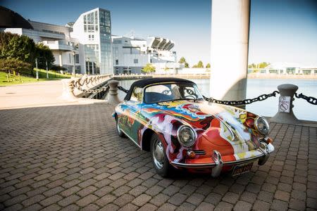 A psychedelically painted 1965 Porsche 365C 1600 Cabriolet once owned by legendary singer Janis Joplin is seen in an undated handout picture courtesy of RM Sotheby's taken outside the Rock and Roll Hall of Fame in Cleveland, Ohio. REUTERS/Courtesy of RM Sotheby's/Darin Schnabel/Handout via Reuters