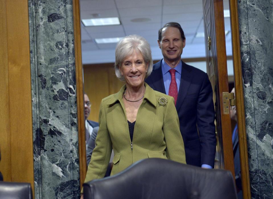 Health and Human Services Secretary Kathleen Sebelius, followed by Senate Finance Committee Chairman Sen. Ron Wyden, D-Ore., arrives on Capitol Hill in Washington, Thursday, April 10, 2014, to testify before the committee's hearing on the HHS Department's fiscal Year 2015 budget. Sebelius said 7.5 million Americans have now signed up for health coverage under President Barack Obama's health care law. That's a 400,000 increase from the 7.1 million that Obama announced last week at the end of the law's open enrollment period. The figure exceeded expectations, a surprise election-year success for the law after a disastrous roll-out. (AP Photo/Susan Walsh)