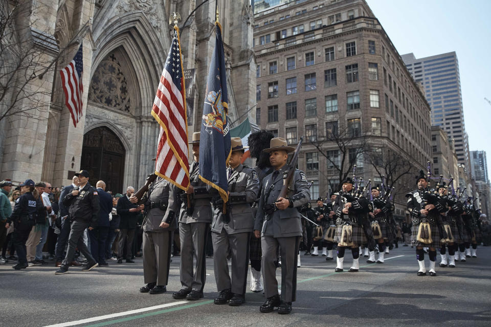 Bagpipers, right, and State Police, center, march along Fifth Avenue during the St. Patrick's Day Parade on Saturday, March 16, 2024, in New York. (AP Photo/Andres Kudacki)