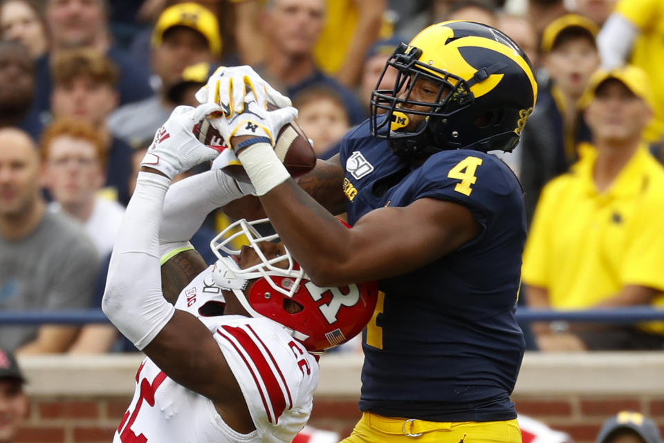 Rutgers defensive back Damon Hayes (22) intercepts a pass intended for Michigan wide receiver Nico Collins (4) in the second half of an NCAA college football game in Ann Arbor, Mich., Saturday, Sept. 28, 2019. (AP Photo/Paul Sancya)