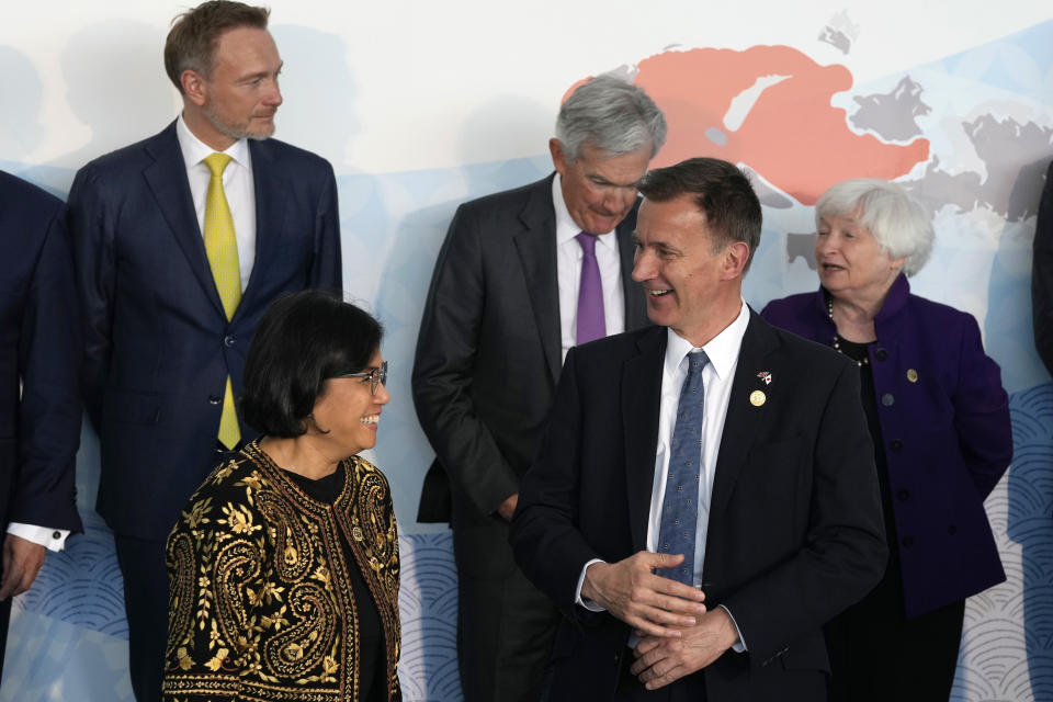 British Chancellor of the Exchequer Jeremy Hunt, front right, talks with Indonesia's Finance Minister Sri Mulyani Indrawati, prior to a group photo session of Group of Seven (G7) finance ministers and central bank governors with invited non-G7 countries' counterparts, at Toki Messe in Niigata, Japan, on Friday, May 12, 2023. (AP Photo/Shuji Kajiyama)